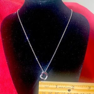 Silver Necklace with Heart Shaped Pendant with 6 clear stones.